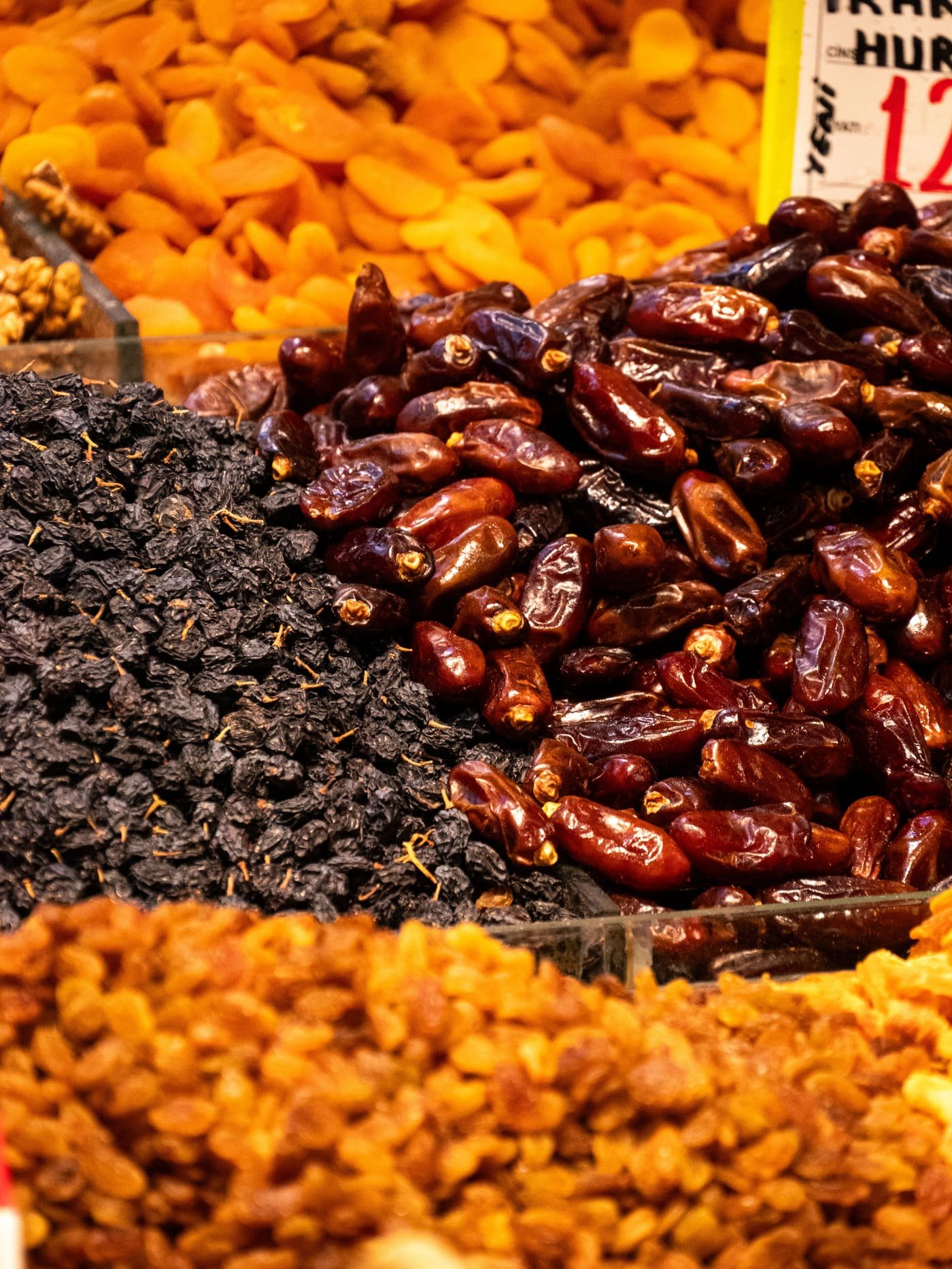 Trays of dates, raisins and dried apricots at a market