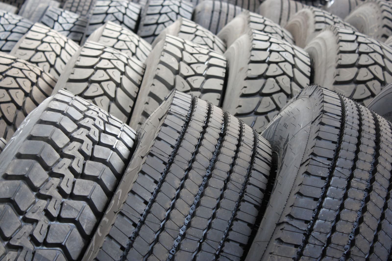 Rows of new tyres showing their tread patterns